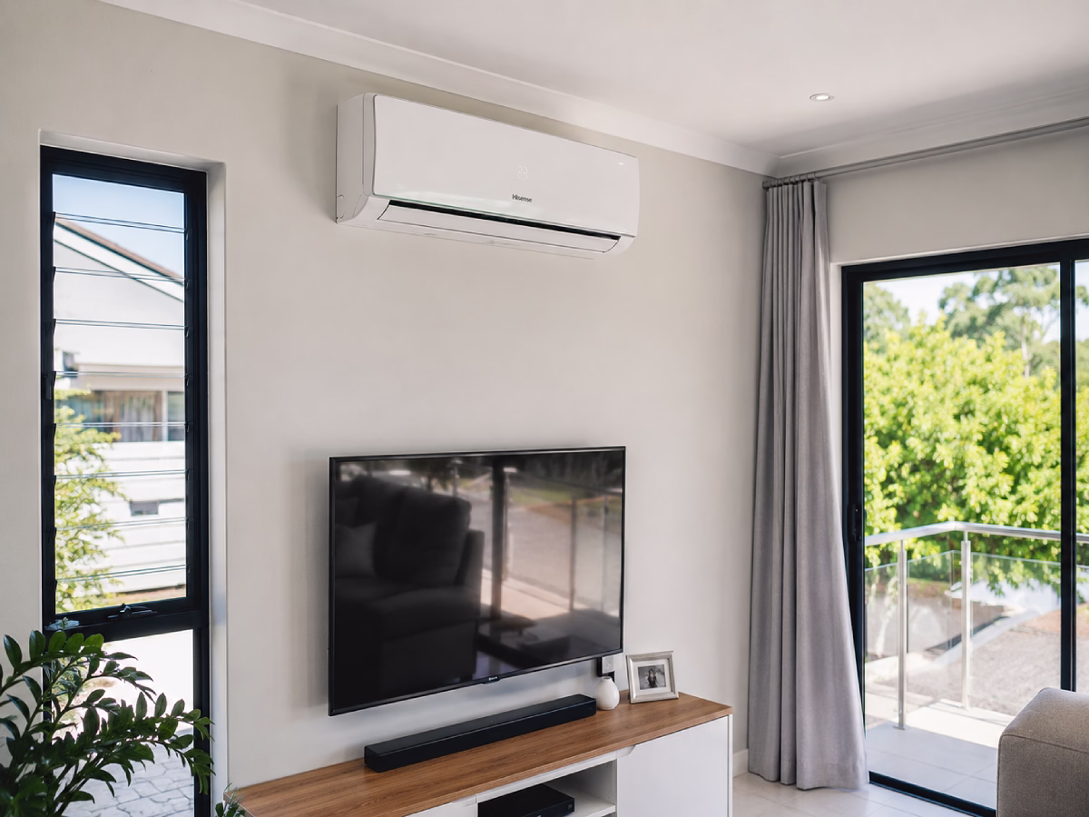 Completed installation with the indoor unit fitted high on a living room wall